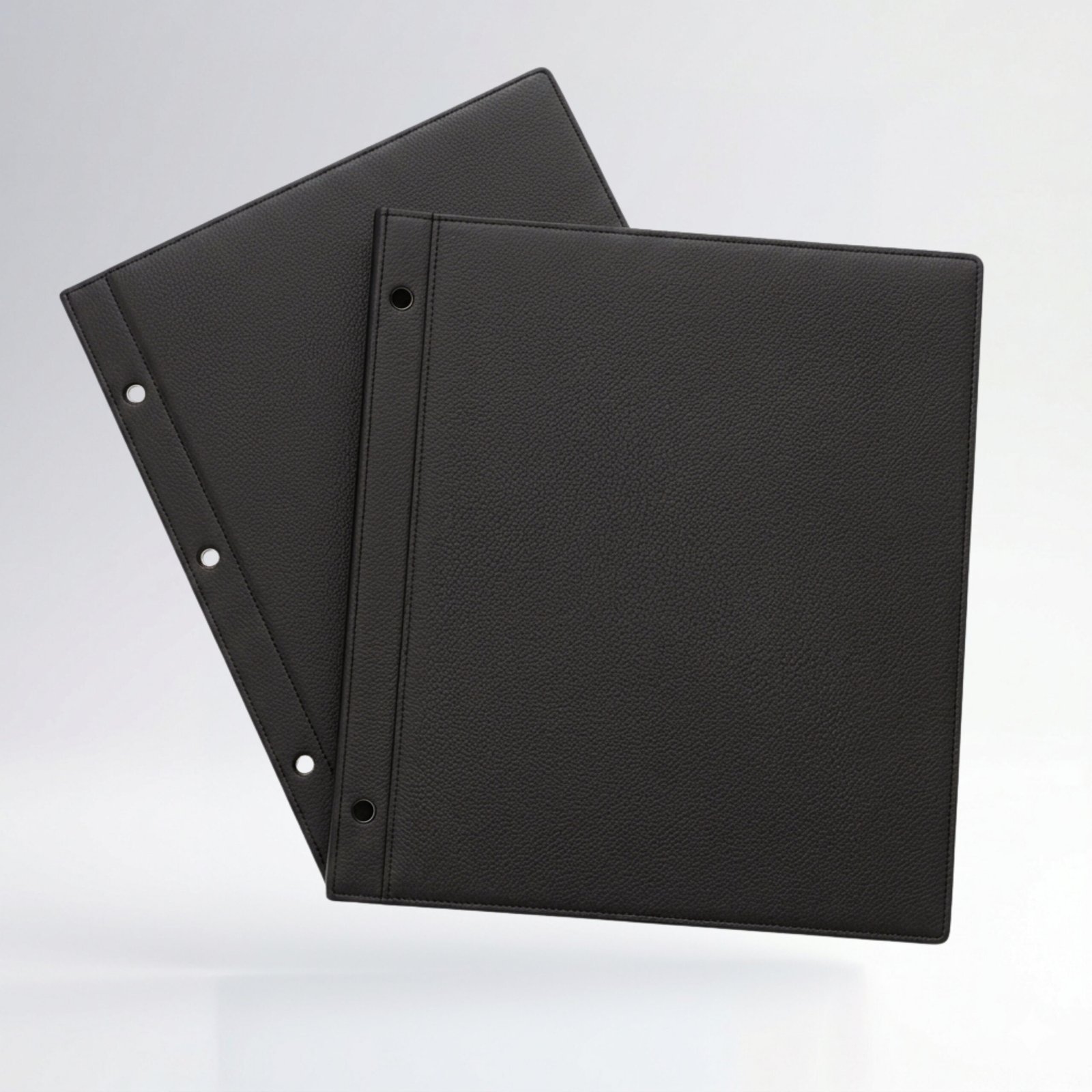 Pastas separables negras para archivo y organización de documentos con perforaciones para sistemas de carpeta y archivado.